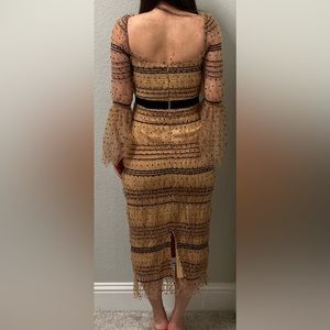 Brown and black tight dress with long puffed sleeves